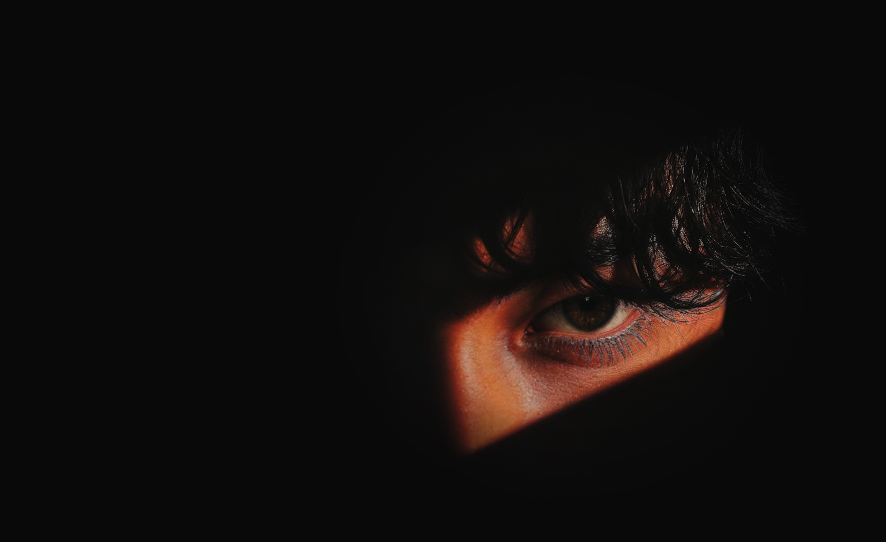 a person eye in dark background